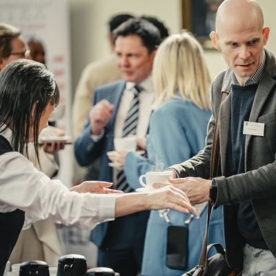 People chatting at a conference